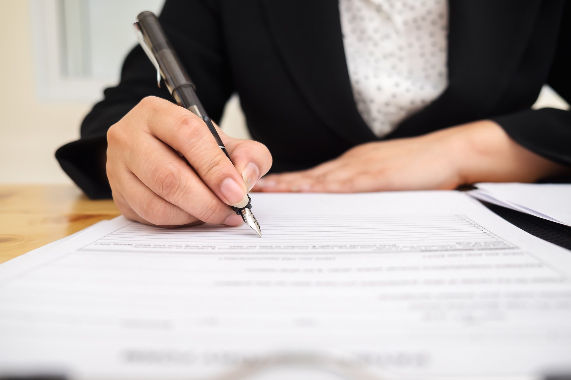 Close Up of Person Signing Contract